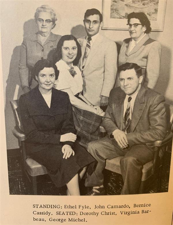 A formal picture of a group of teachers from 1954.